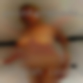 Longish looking brown-red hair, and about 5'5.